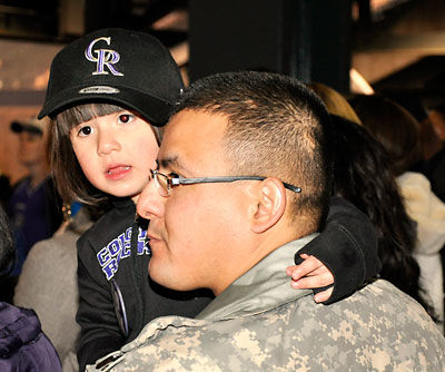 Michelle Obama applauds military families at Coors