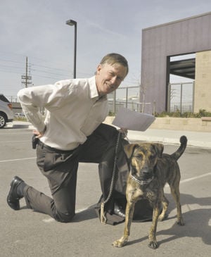 Two bill signings mark dog day at the Legislature