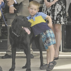 Two bill signings mark dog day at the Legislature