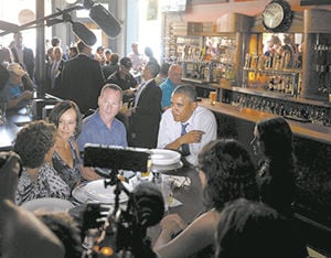 A slice of pizza, a sip of beer, a game of pool...