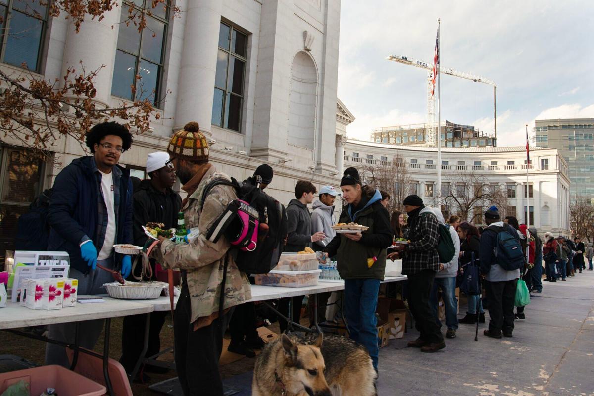 Volunteers with Mutual Aid Monday pass out food (copy)