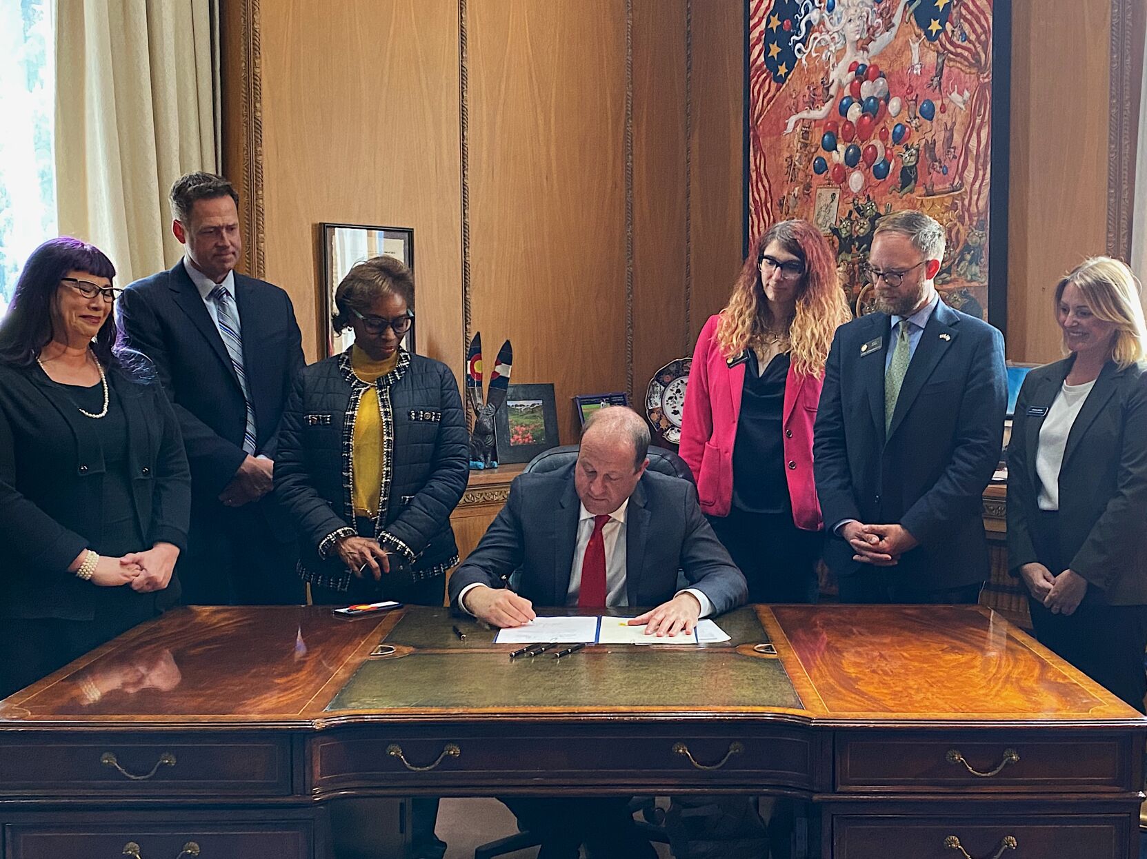 Polis signs bills to protect sex workers from violence, keep people with mental health issues out of jail