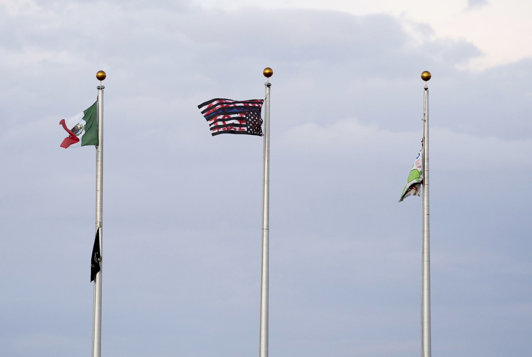 Police investigate after US flag removed from Aurora ICE facility during protest