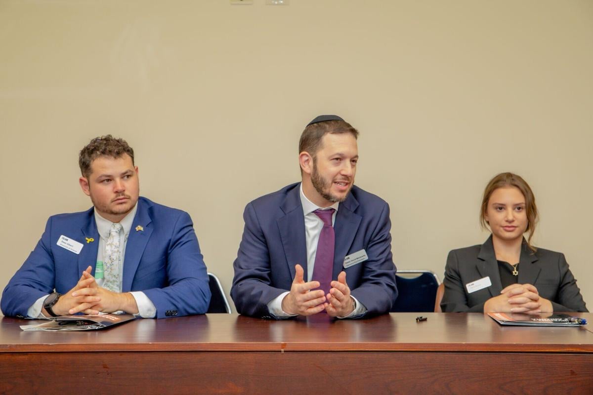 Talia and others speak with Israeli government officials