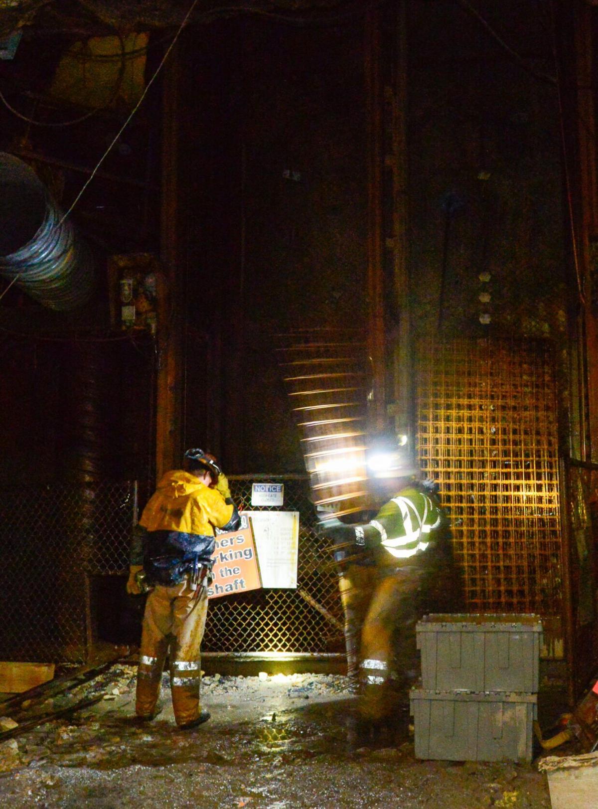Uranium miners unload steel grates at the Pinyon Plain Mine.jpg