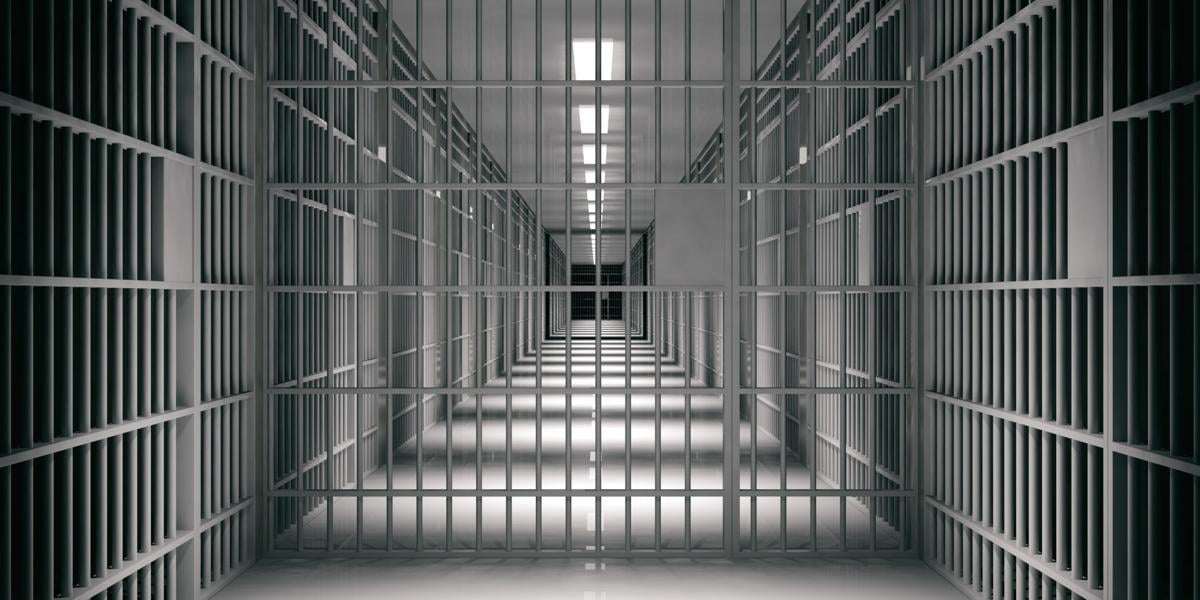 Prison interior. Jail cells, dark background.