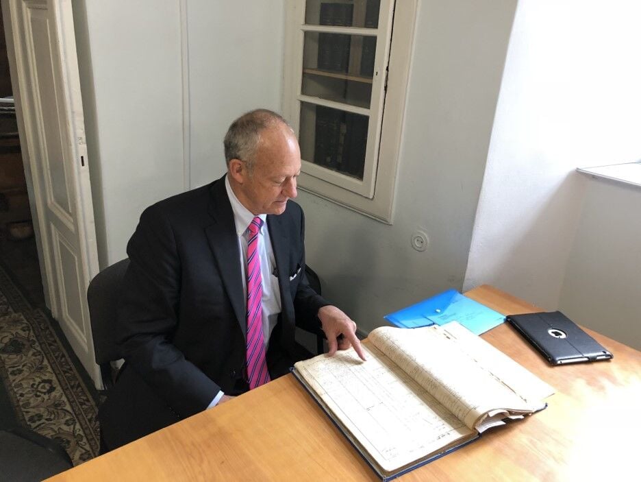 Tim Tymkovich looking at Ukrainian census book