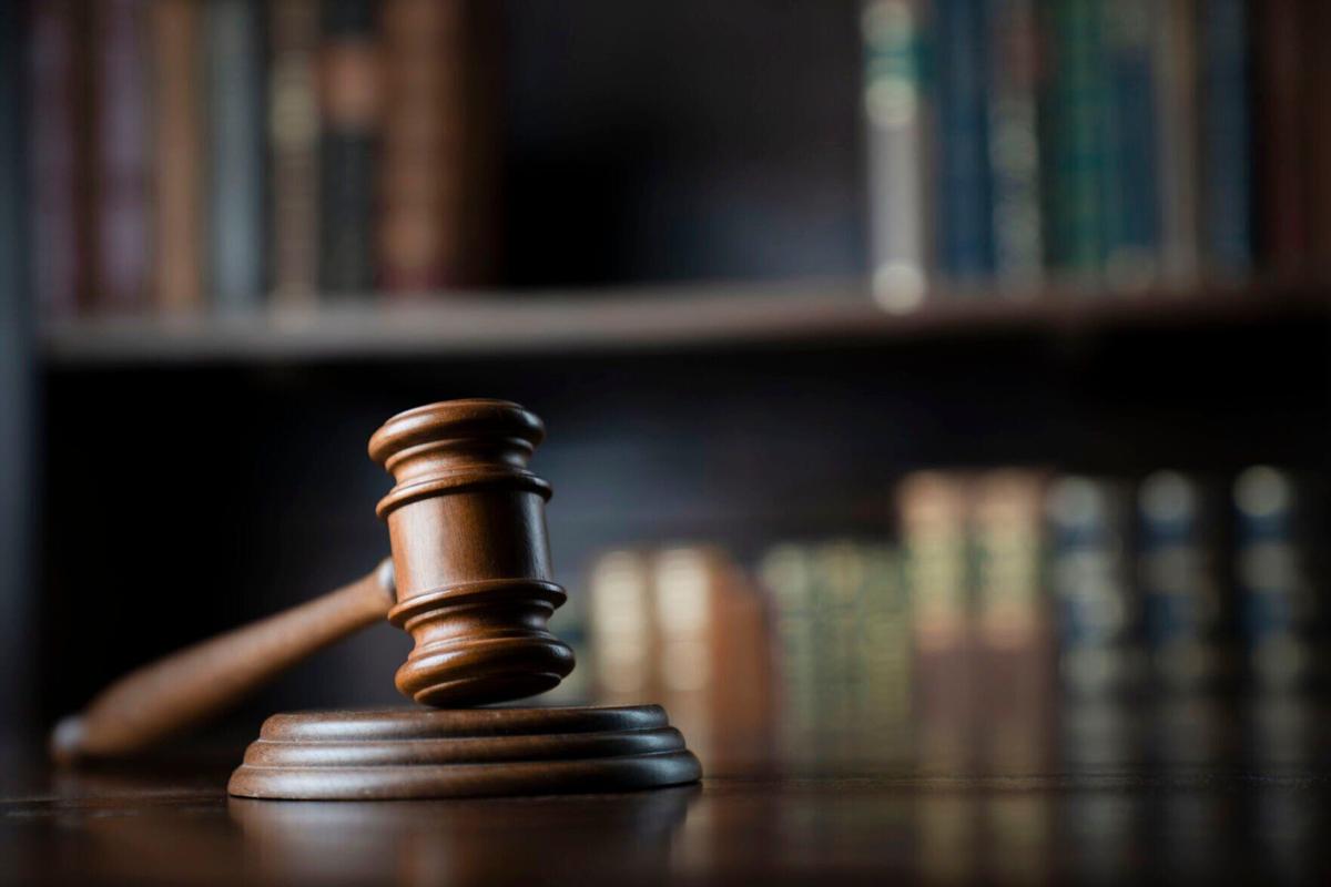 Judge's office - gavel pictured on desk in front of library of books (copy) (copy)