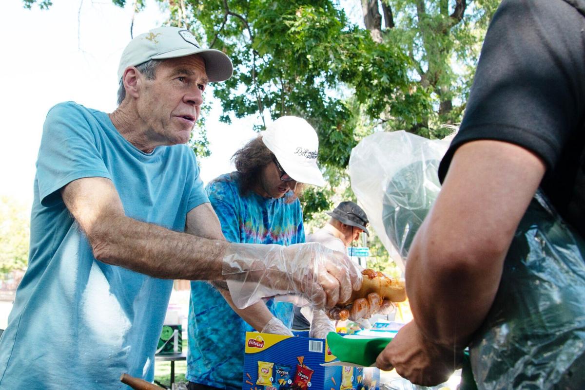 Bill Briggs and other members of Streetscape Boulder, a local non-profit, hand out food
