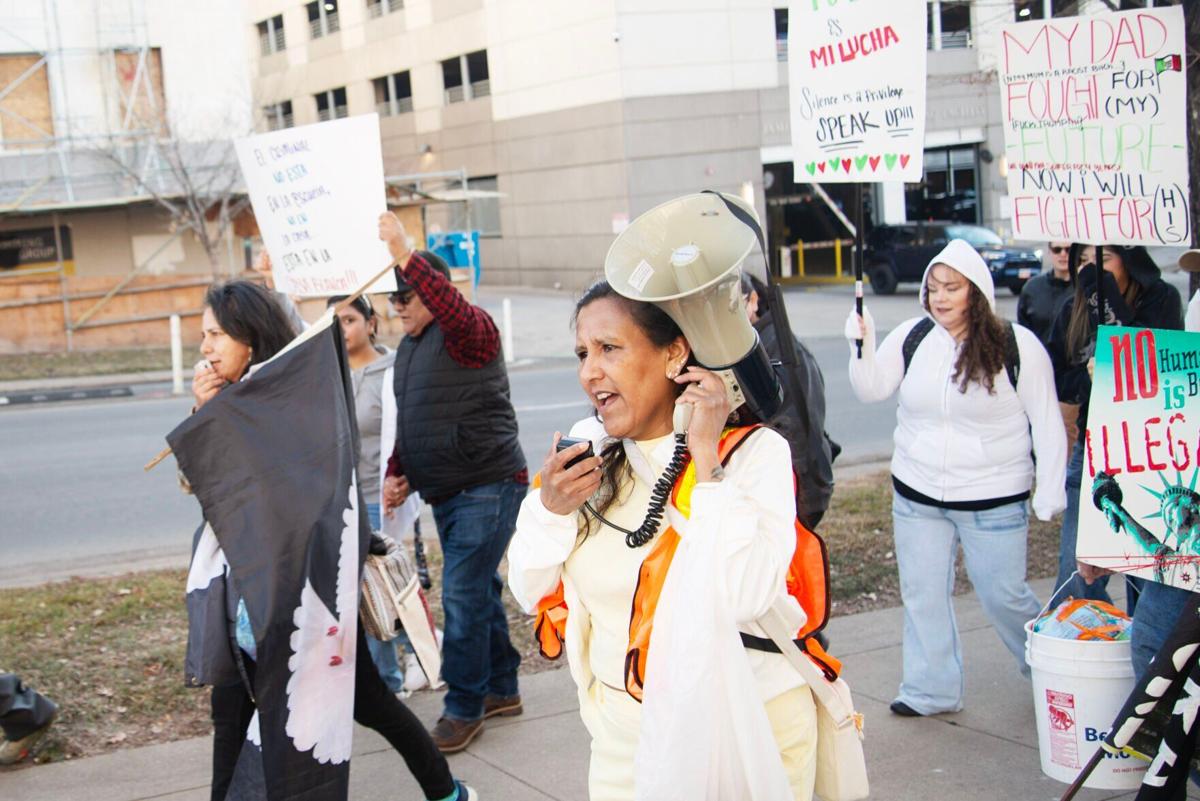 Jeanette Vizguerra leads chants through a megaphone