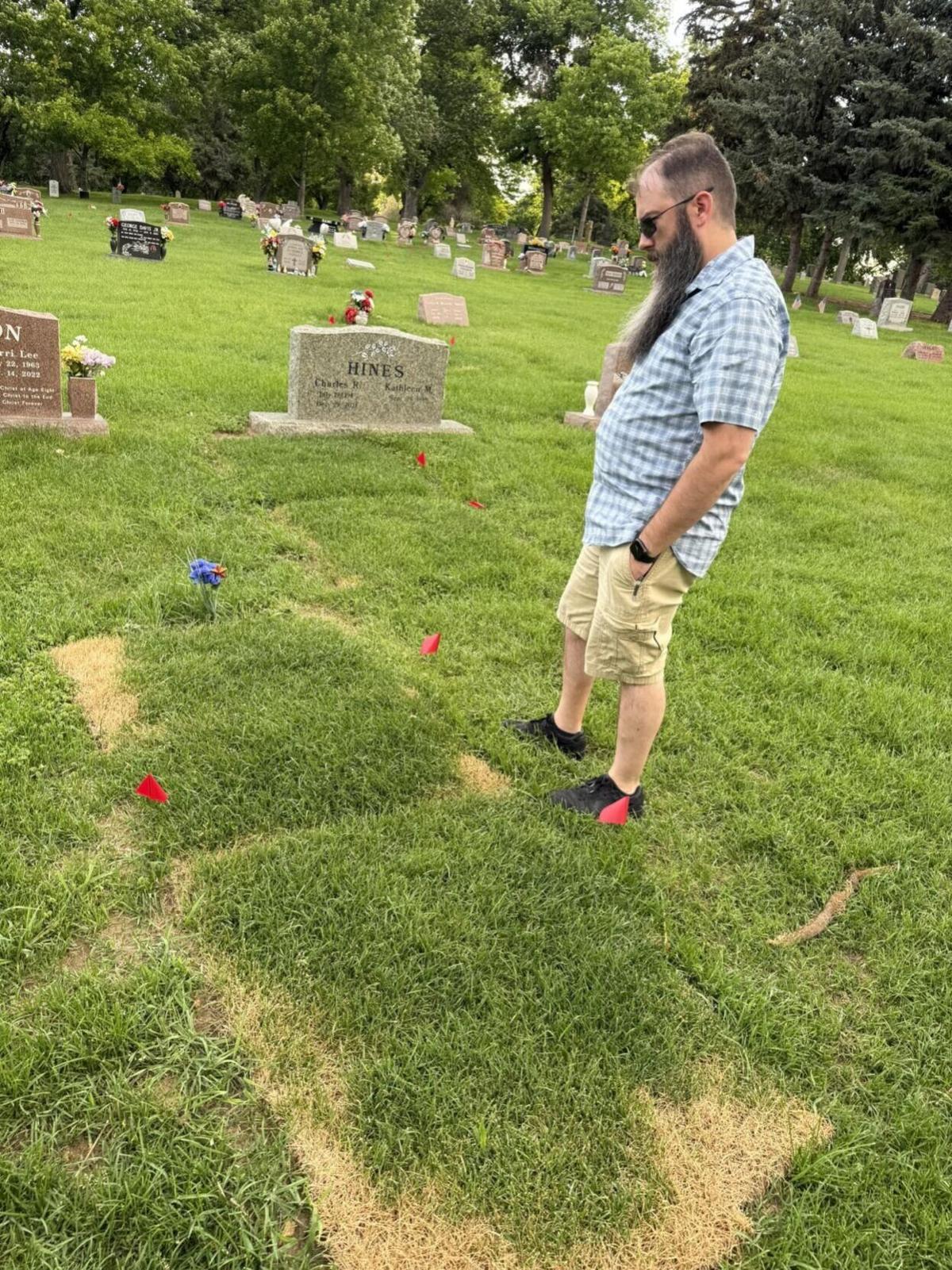 Ezzy's adoptive father at her graveside