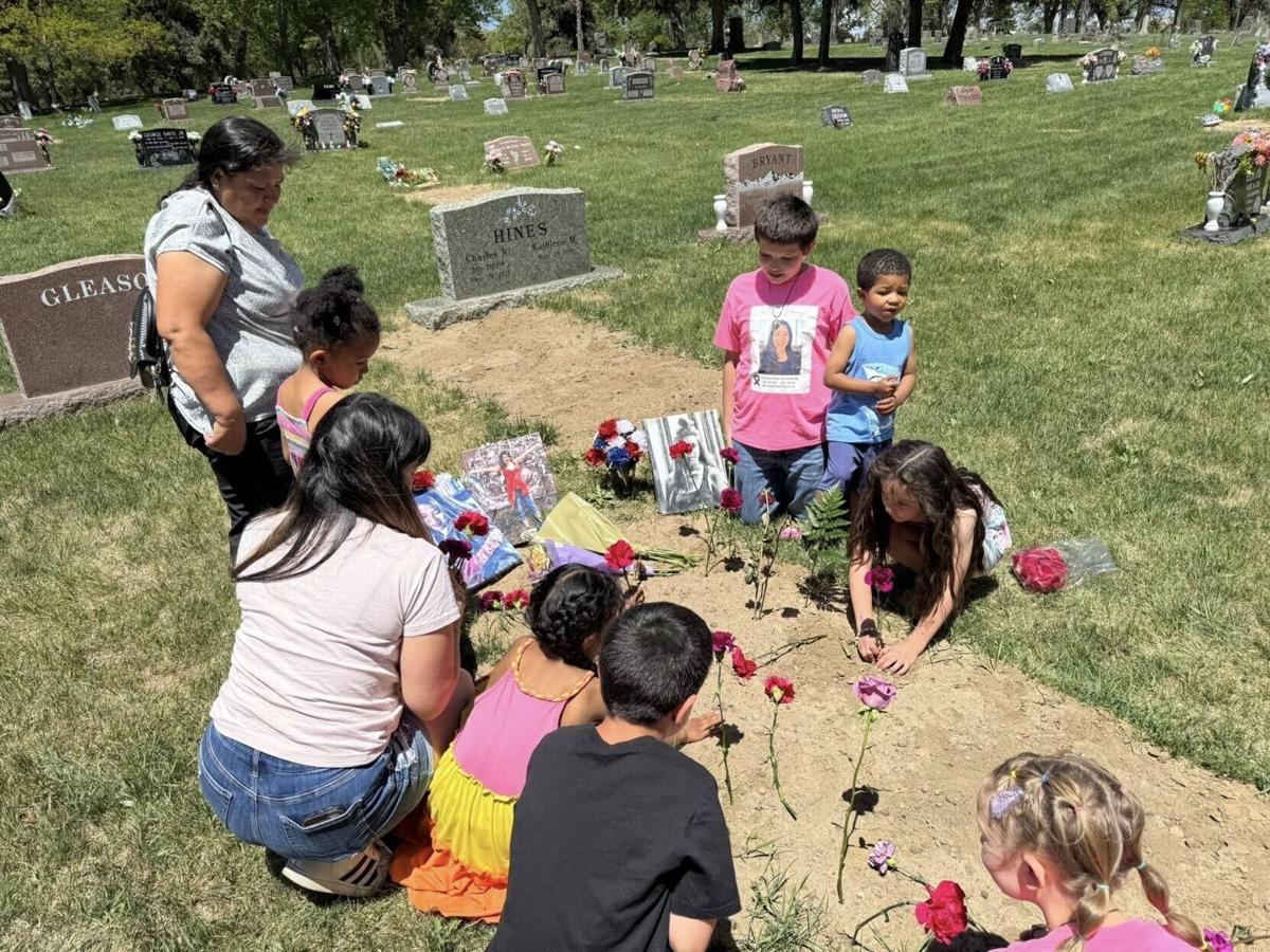 Ezzys birth mom_sister_children_neices and nephews graveside 1 year anniversay.jpg