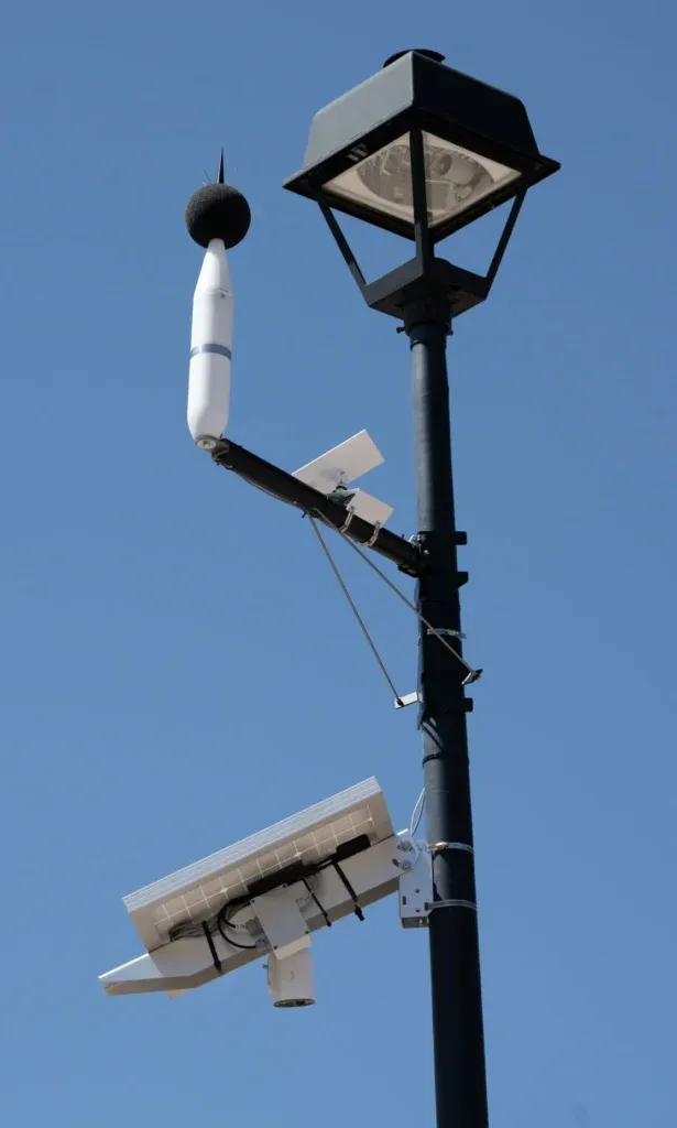 A noise monitoring microphone on top of a streetlight in a Colorado Springs neighborhood