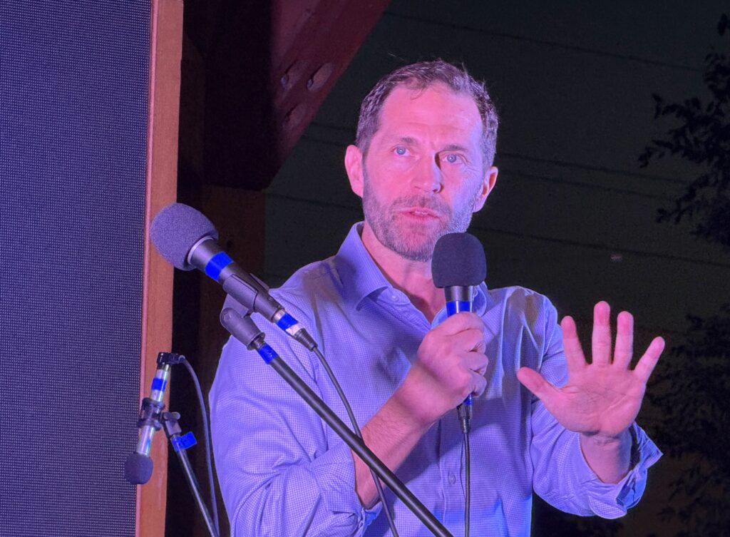U.S. Rep. Jason Crow, an Aurora Democrat, welcomes supporters to Crow Fest, an annual campaign fundraiser, on Sept. 27, 2025, at Breckenridge Brewery in Littleton. (Ernest Luning/Colorado Politics)