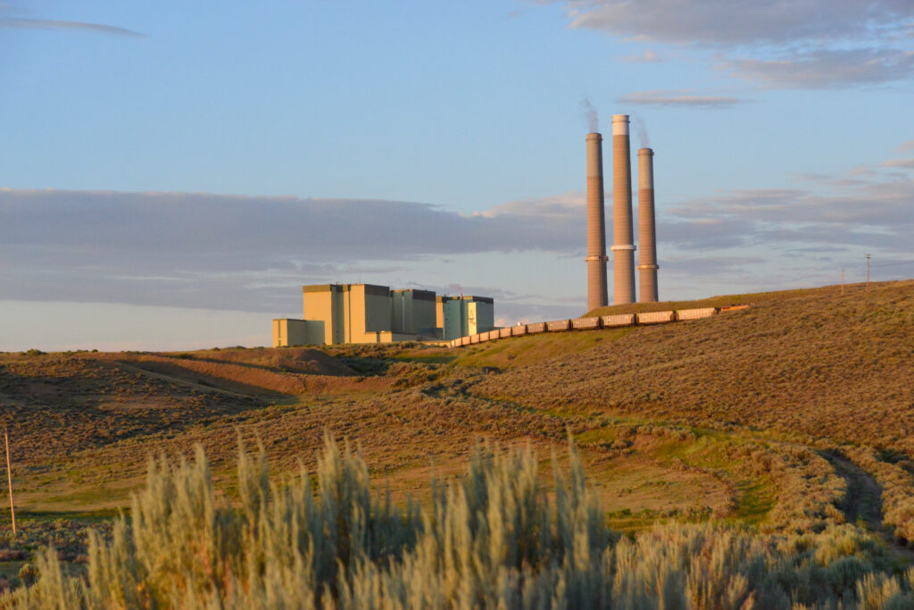 coal power plant on a hill at dusk