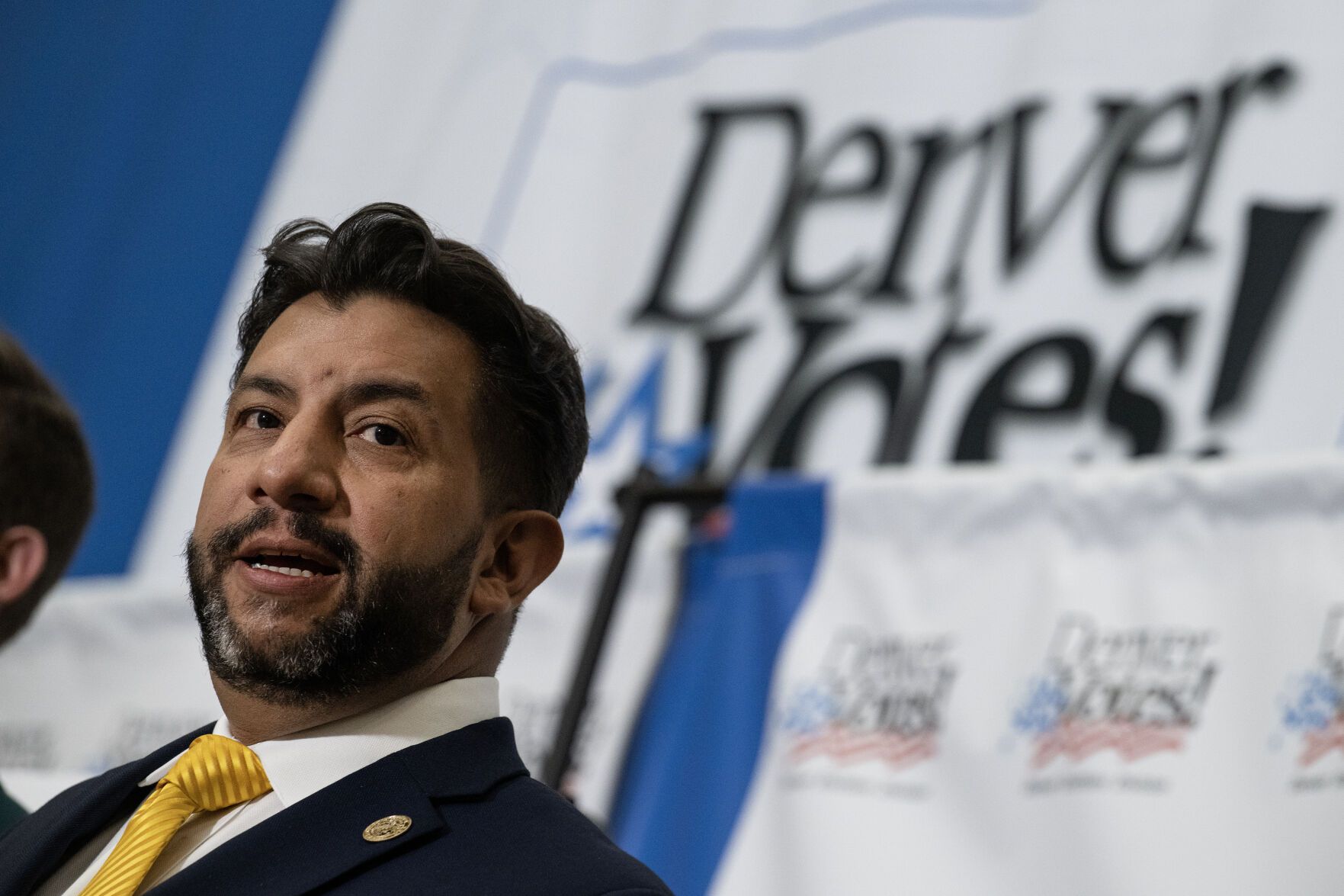 a man speaking at a podium