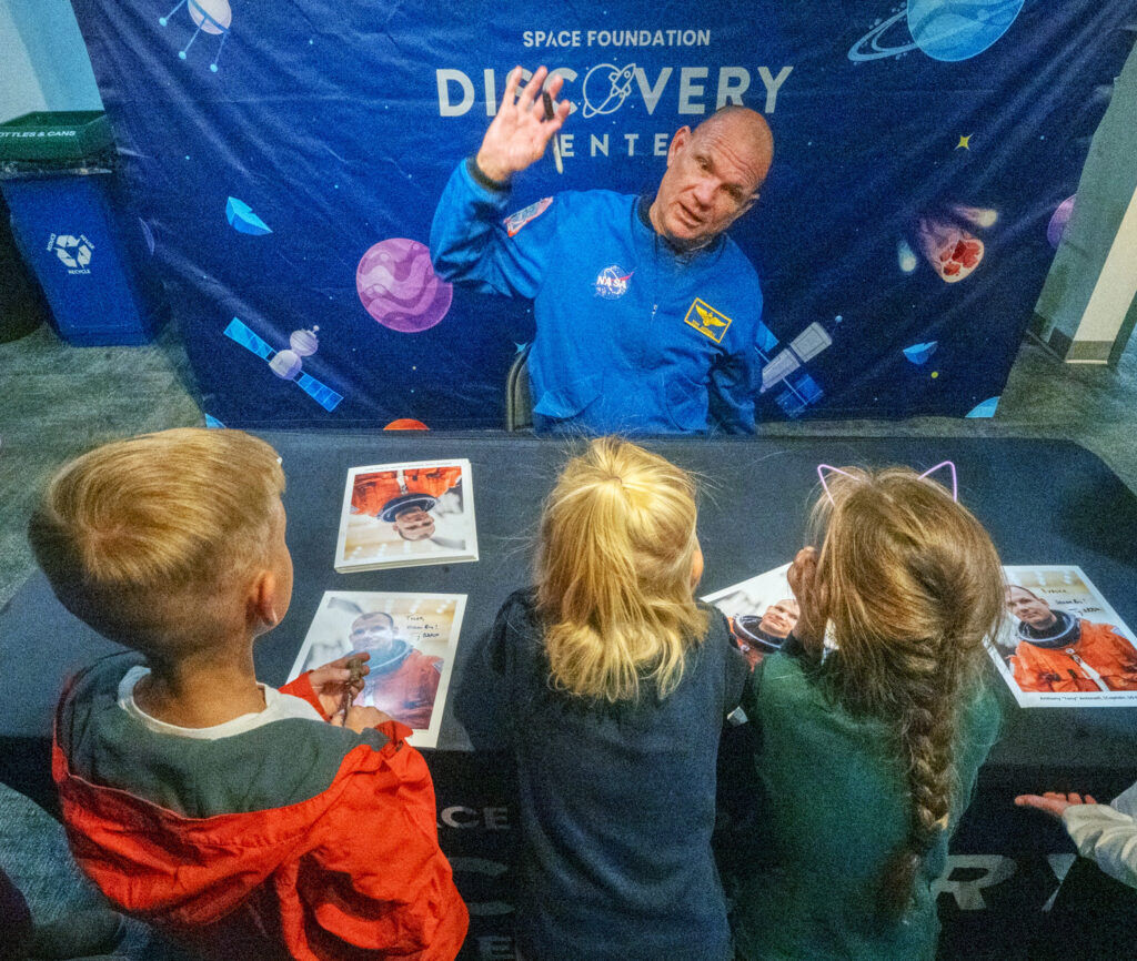 Retired NASA astronaut Dominic Anthony "Tony" Antonelli entertains children at the Space Foundation Discovery Center with a story about doing flips at the ISS (International Space Station) and hitting his head on the ceiling. Wednesday, Oct. 29, 2025. Antonelli will spend his week traveling around to talk with students at schools in School District 11.