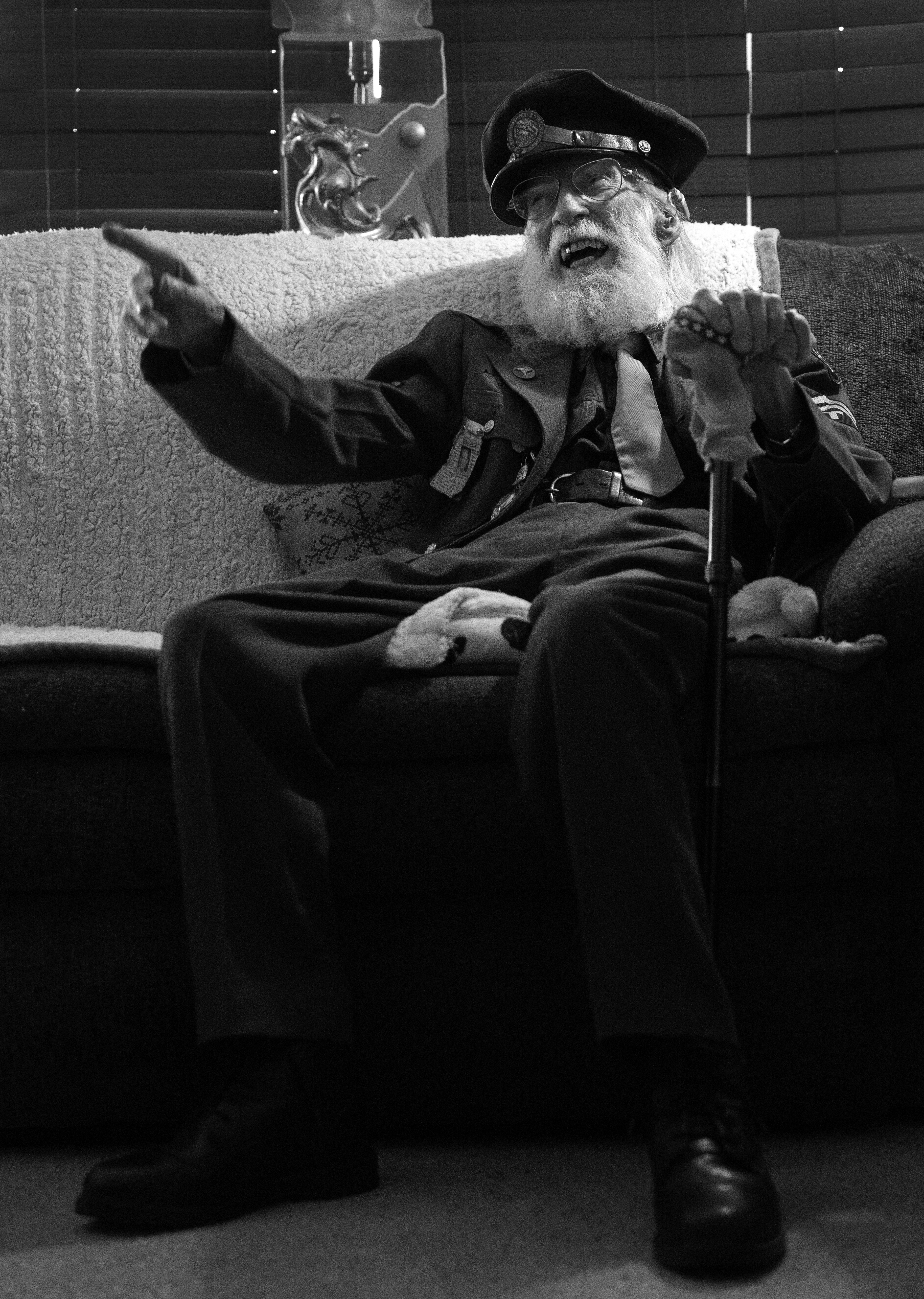 A world war II veteran tells stories sitting on his couch in his Colorado Springs home.