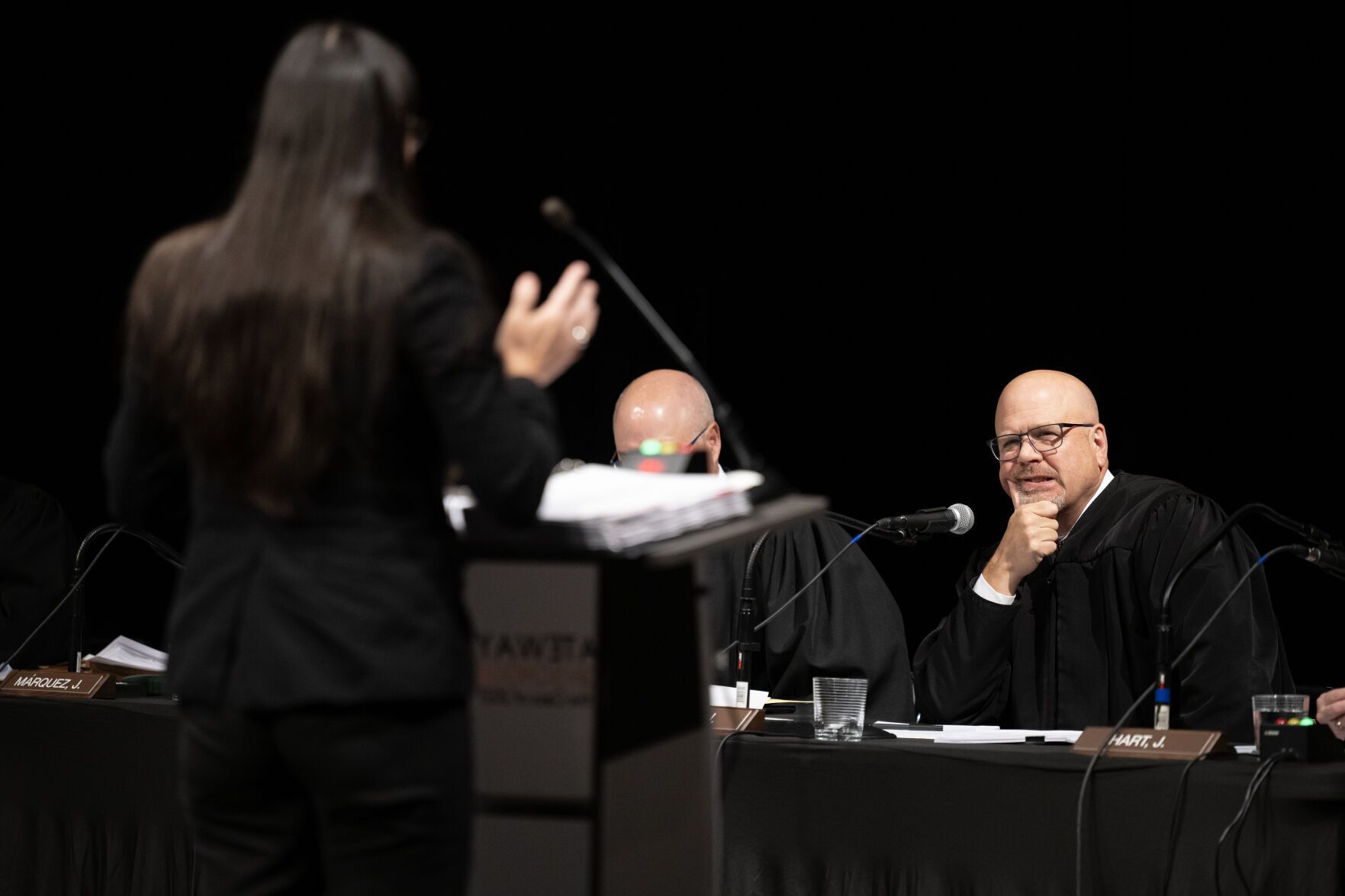 Colorado Supreme Court Justice William W. Hood III looks on after asking a question to Assistant Deputy Jefferson County Attorney Rebecca P. Klymkowsky during oral arguments in the County of Jefferson v. Beverly Stickle case during Courts in the Community on Thursday, Oct. 26, 2023, at Gateway High School in Aurora, Colo. (Timothy Hurst/Denver Gazette)