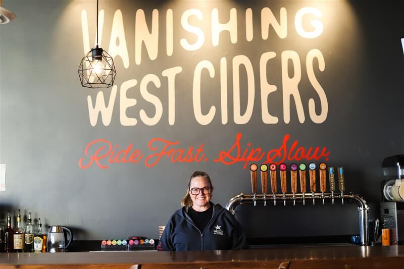 Owner Heather Adams poses for a portrait in her cidery, Vanishing West.
