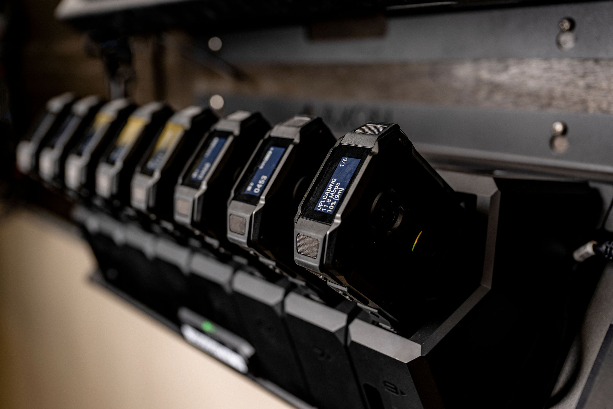 a bank of body-worn cameras charging