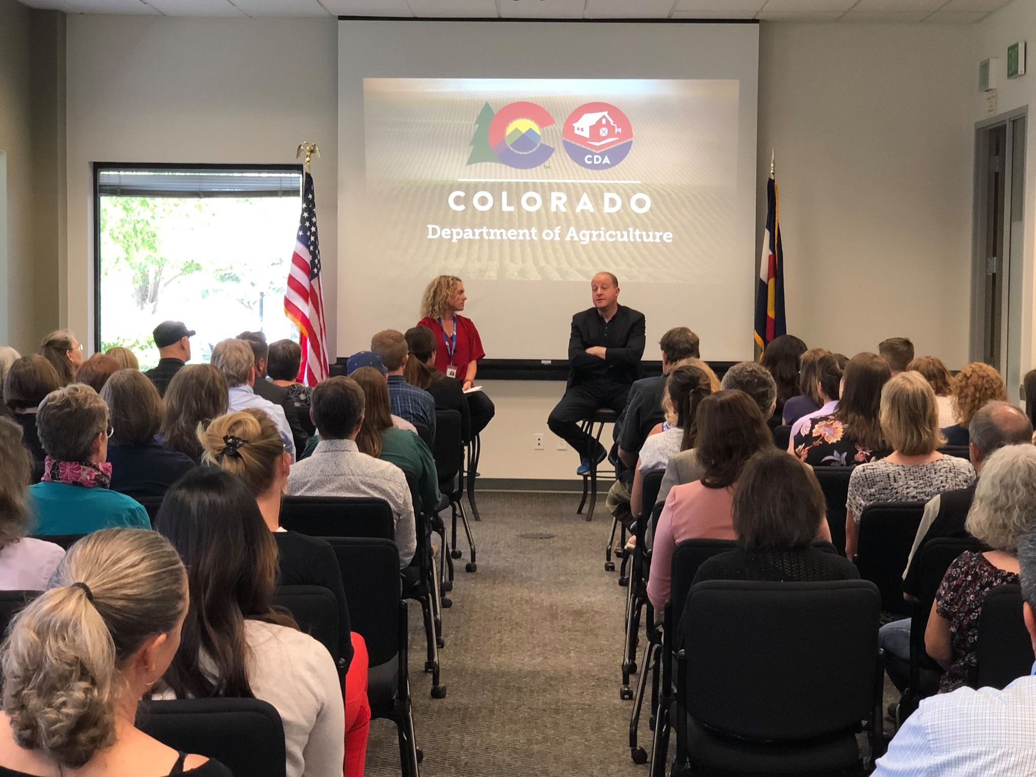 Gov. Jared Polis speaks to staff of the Colorado Department of Agriculture while touring the agency's new Division of Laboratory Services building in Broomfield in January.
