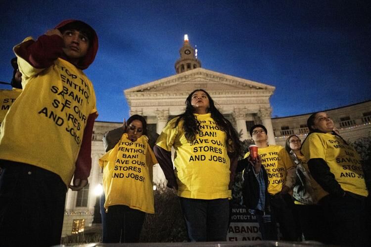 a group of people protest Denver's proposed ban of flavored tobacco