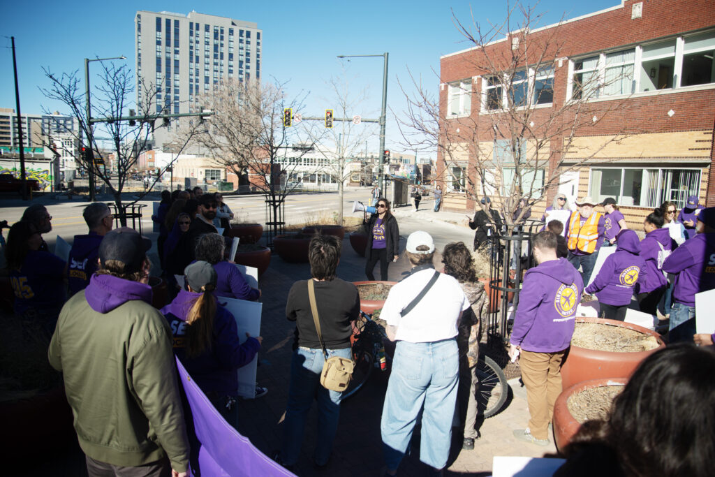 a group of union people holding signs