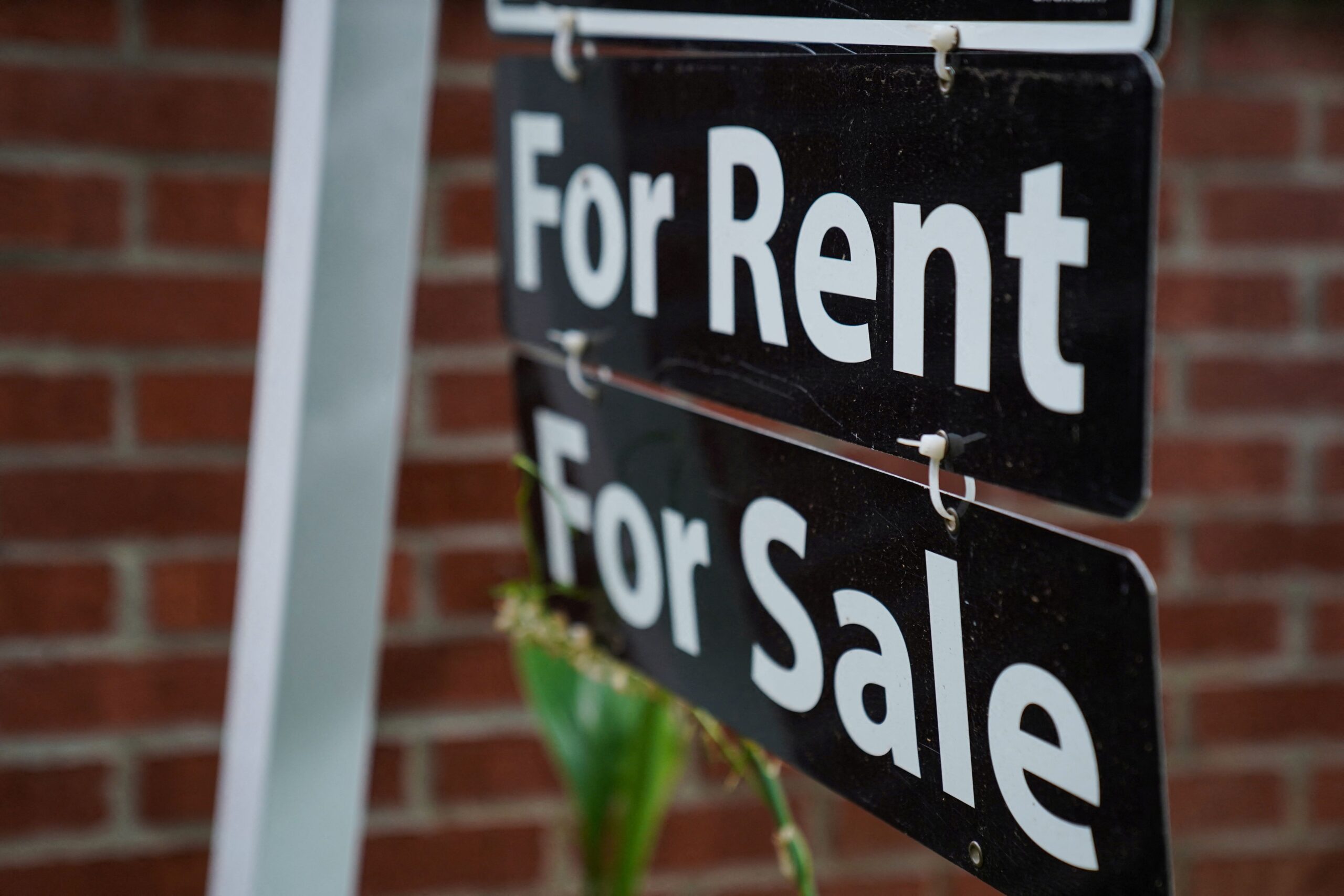 FILE PHOTO: A “For Rent, For Sale” sign is seen outside of a home in Washington, U.S., July 7, 2022. REUTERS/Sarah Silbiger