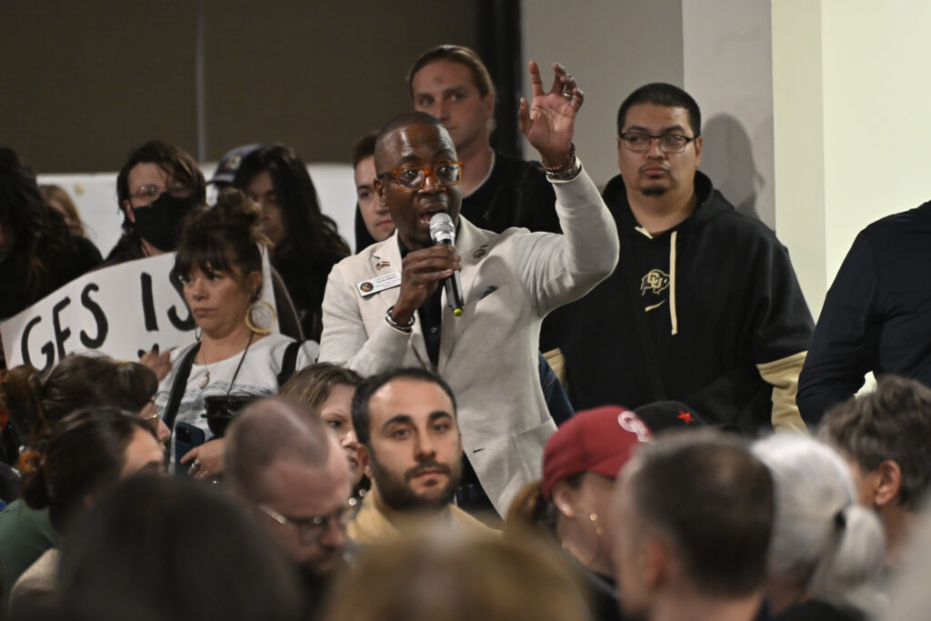 a man standing in a crowd 