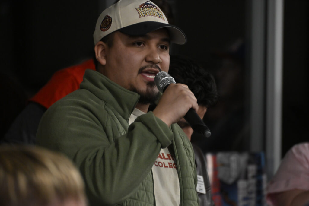 a man standing with a microphone