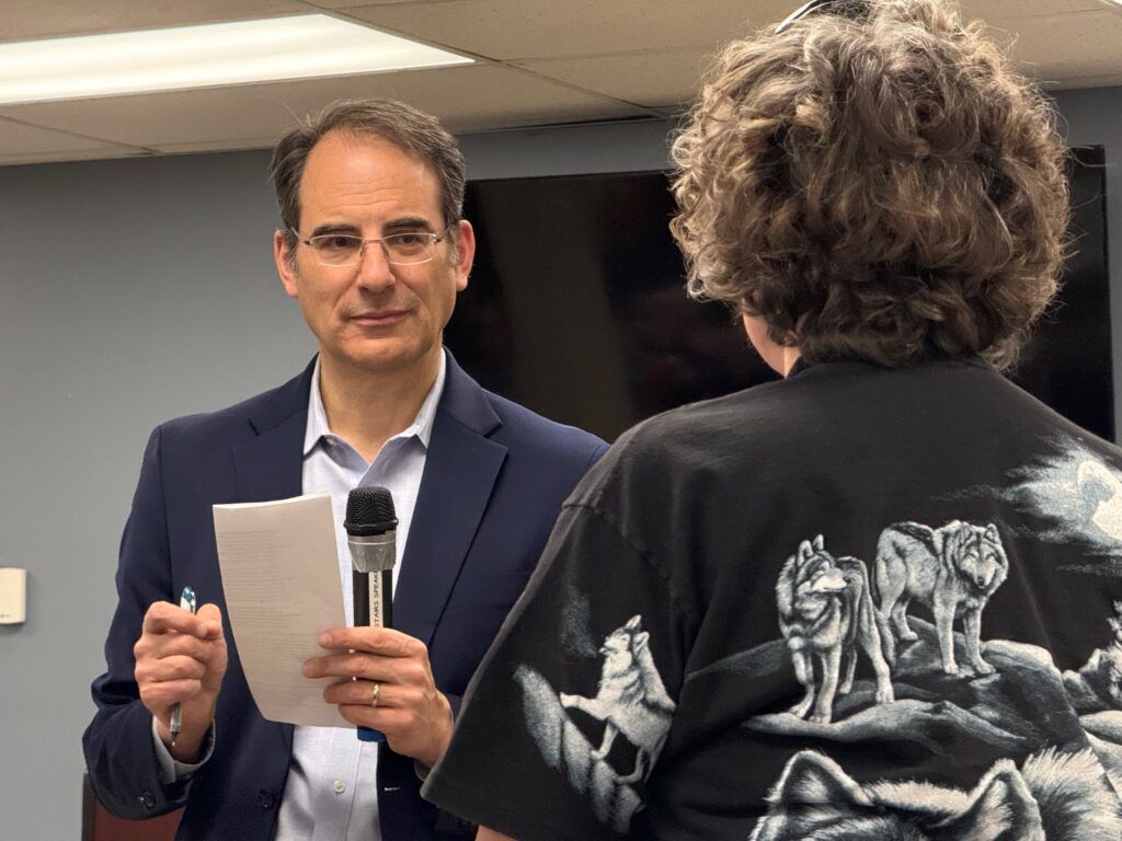 Colorado Attorney General Phil Weiser, left, a Democratic gubernatorial candidate, answers a question at a campaign town hall on Jan. 24, 2026, at Charles Whitlock Recreation Center in Lakewood. (Ernest Luning/Colorado Politics)
