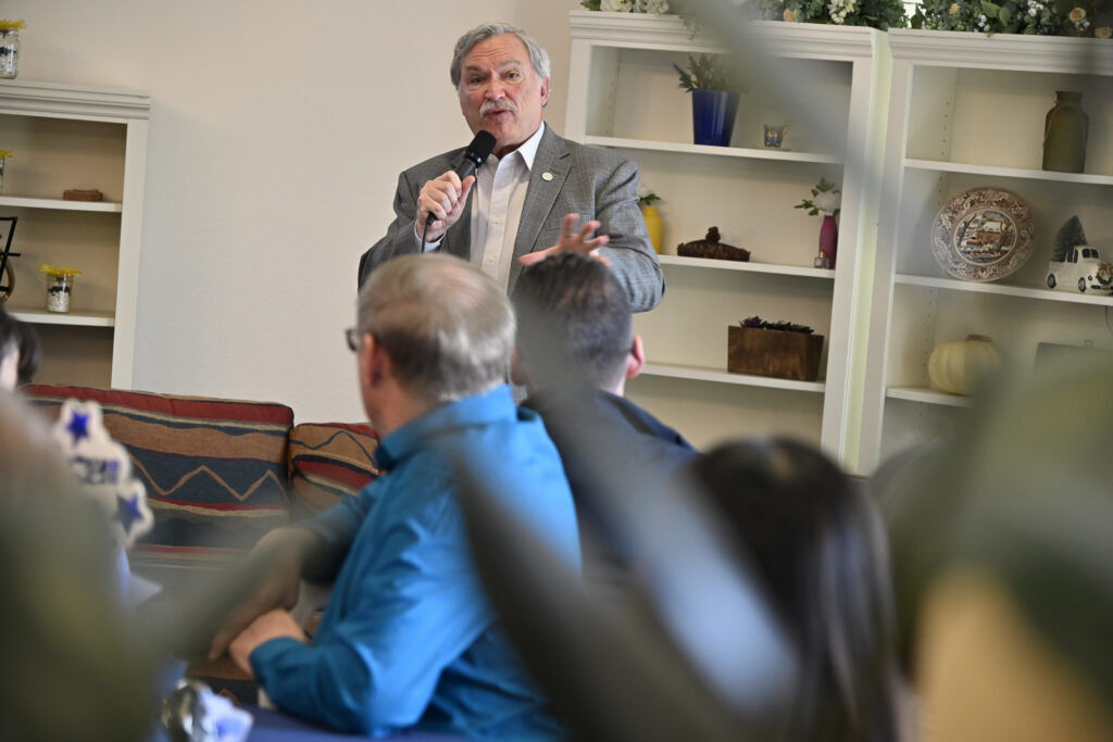 a man speaking at small coffee shop