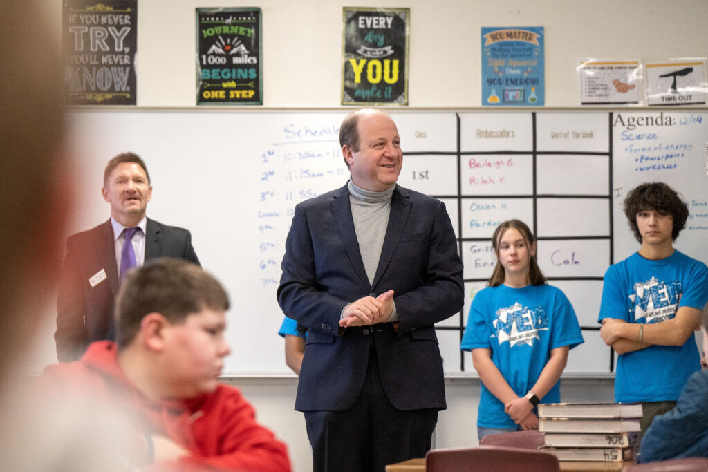 Gov. Jared Polis visits with students in Mr. Sneller’s sixth-grade science class during a visit to Jenkins Middle School, a Purple Star School in Colorado Springs on Thursday, December 4, 2025. (The Gazette, Michael G. Seamans)