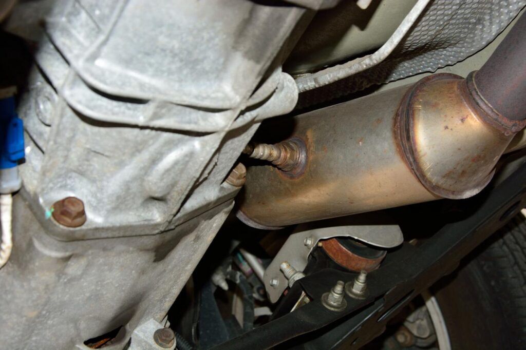 underside view of an automobile showing the catalytic converter