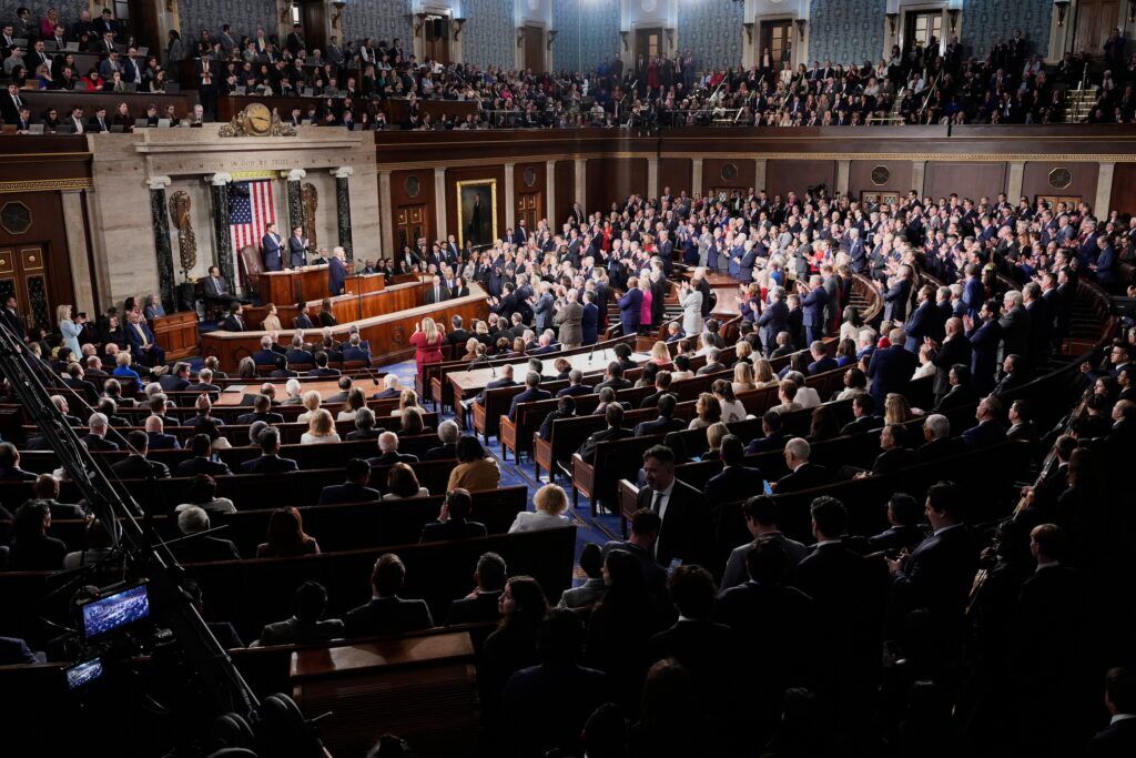 Republican members of Congress stand while Democrats keep their seats during President Donald Trump's State of the Union address to a joint session of Congress in the House chamber at the U.S. Capitol in Washington on Feb. 24, 2026. (AP Photo/Alex Brandon)