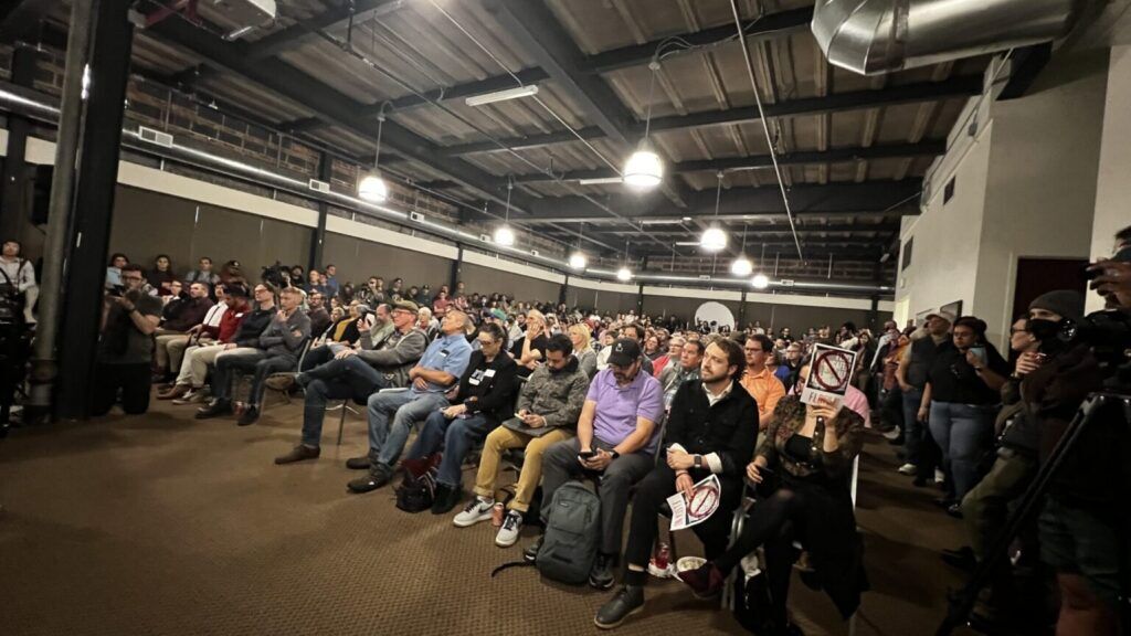 people gathered at community meeting