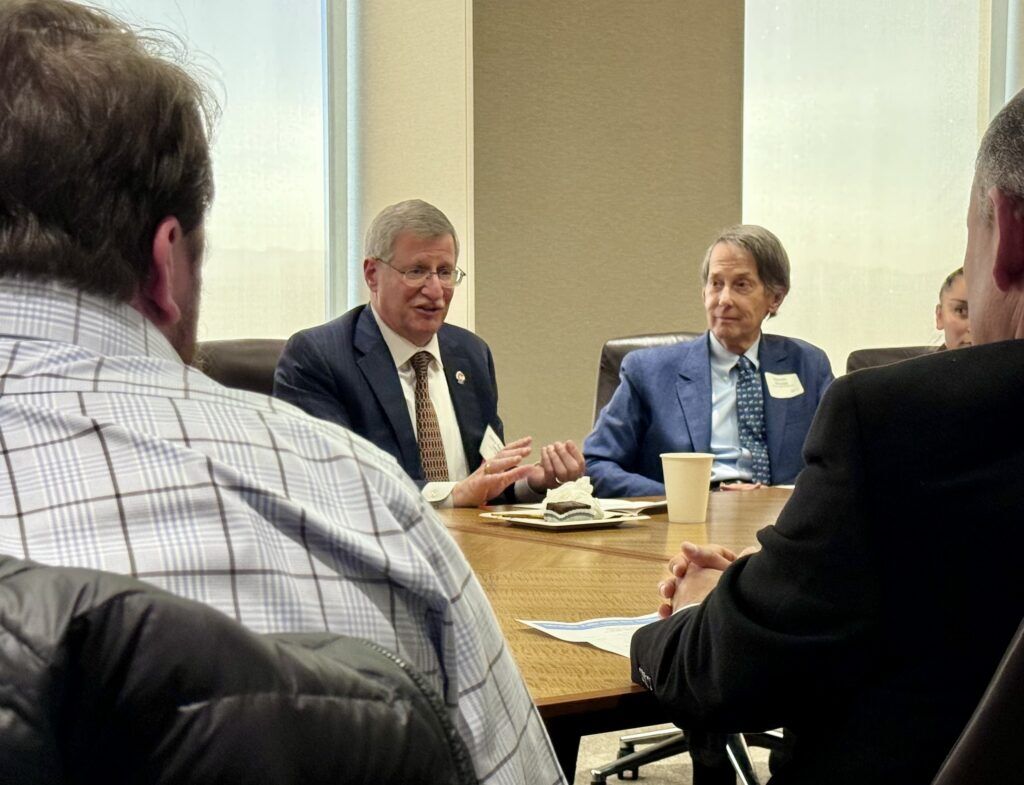 Justice Richard L. Gabriel, at left, speaks to lawyers on March 11, 2026 in Denver at an event featuring the Colorado Supreme Court. Michael Karlik, Colorado Politics.