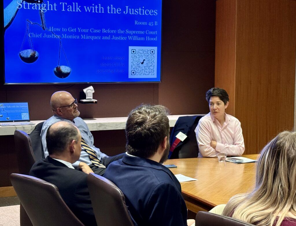 Chief Justice Monica M. Márquez, right, and Justice William W. Hood III, left, speak to lawyers in Denver about the Colorado Supreme Court on March 11, 2026, at an event sponsored by the Colorado Judicial Institute and Wheeler Trigg O'Donnell LLP. Michael Karlik, Colorado Politics.