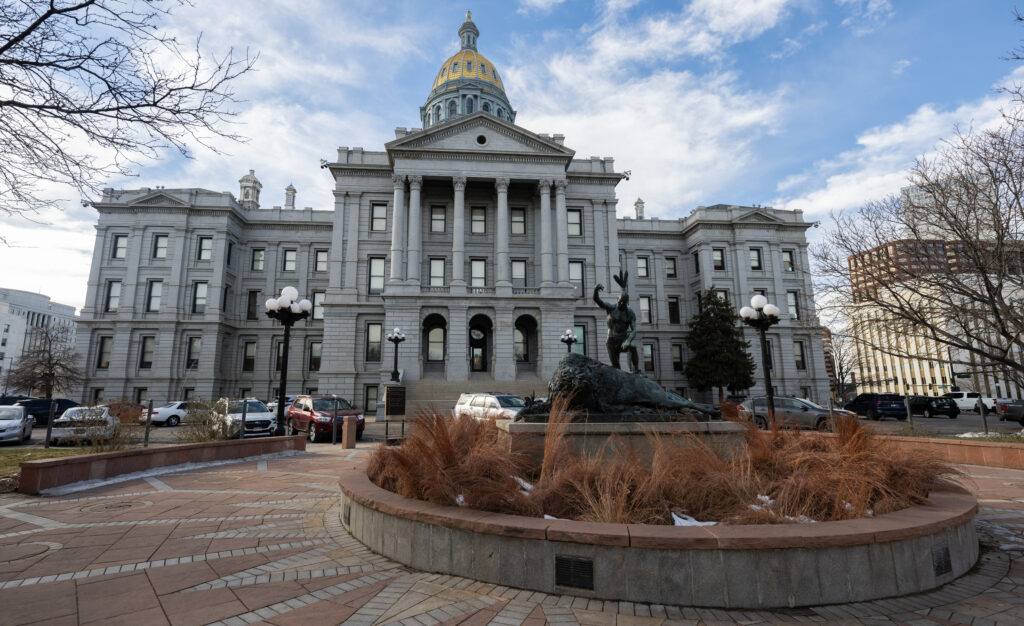 a state capitol building with a gold dome