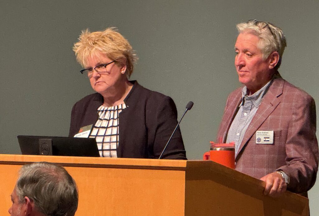 Colorado Republican Party Chairwoman Brita Horn, left, and GOP Secretary Russ Andrews observe the crowd at the state party's central committee meeting on Sept. 27, 2025, in Aurora. (Ernest Luning/Colorado Politics, File)