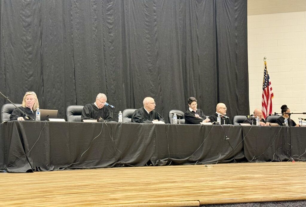 Members of the Colorado Supreme Court participate in oral arguments at Holyoke Junior/Senior High School in Holyoke, Colo. on April 16, 2026 as part of the "Courts in the Community" program. Michael Karlik, Colorado Politics.