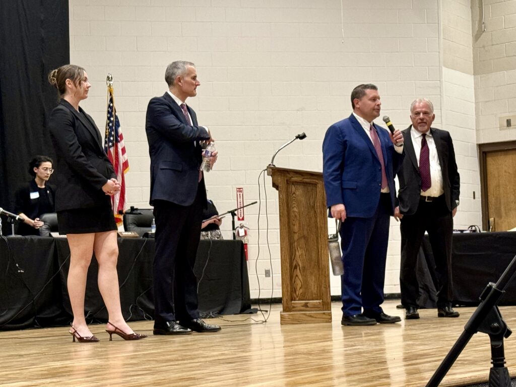 Attorneys Kaitlin M. DeWulf, Michael J. Hofmann, Trenton J. Ongert, and Joseph D. Bloch answer students' questions at Holyoke Junior/Senior High School in Holyoke, Colo. on April 16, 2026 as part of the judicial branch's "Courts in the Community" program. Michael Karlik, Colorado Politics.