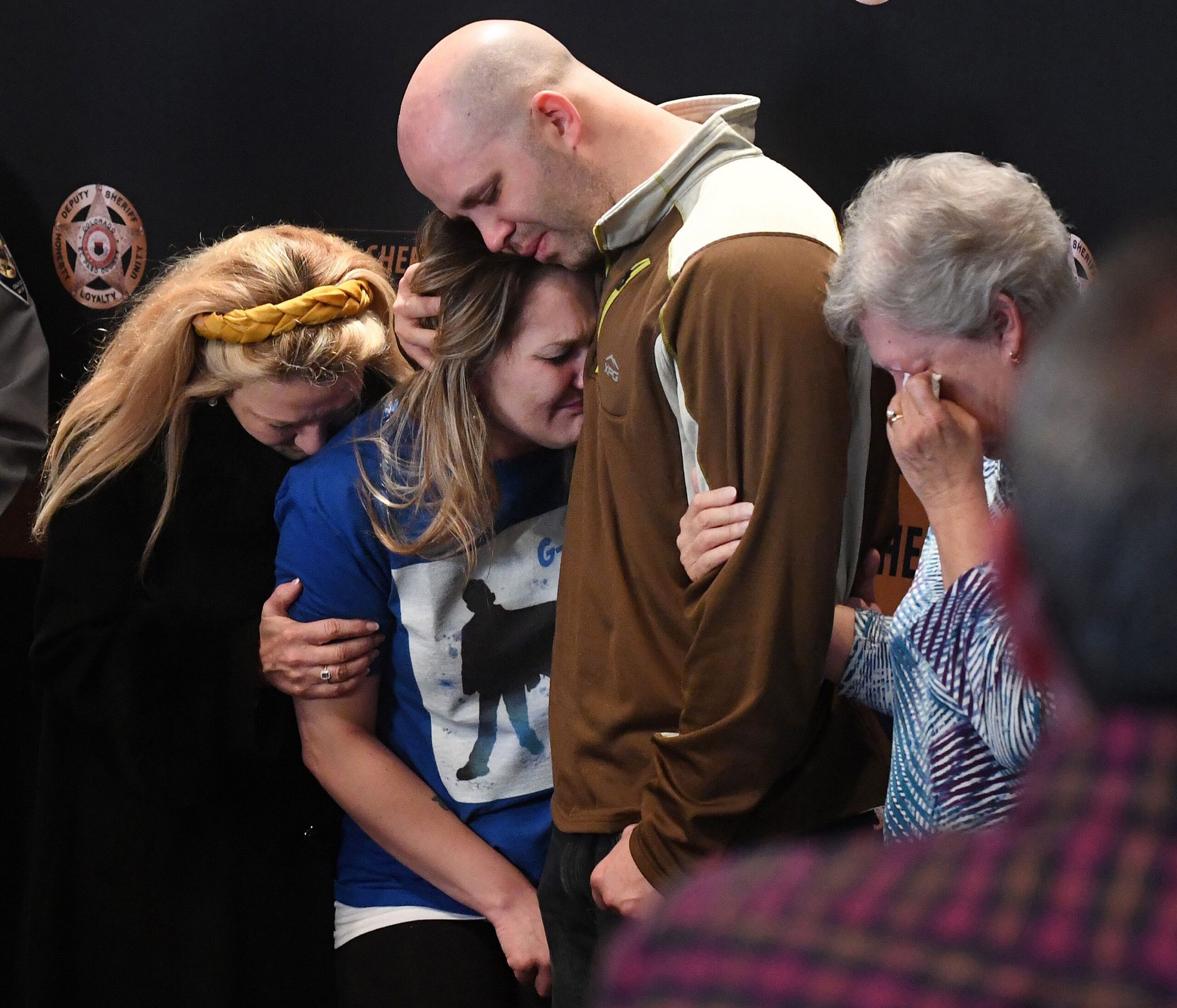 Landen Hiott (center) is comforted by her aunt, Veronica Birkenstock, and Albert Stauch after the announcement that Gannon Stauch's stepmother, Letecia Stauch, was arrested and charged with 1st degree murder of Gannon. Albert Stauch and Landen Hiott are the parents of Gannon Stauch. The investigation into the disappearance of Gannon Stauch, 11, began on Jan. 27, 2020, when the stepmother called 9-1-1 to report him missing from a subdivision near Colorado Springs, Colorado. (Photo by Jerilee Bennett, The Gazette)