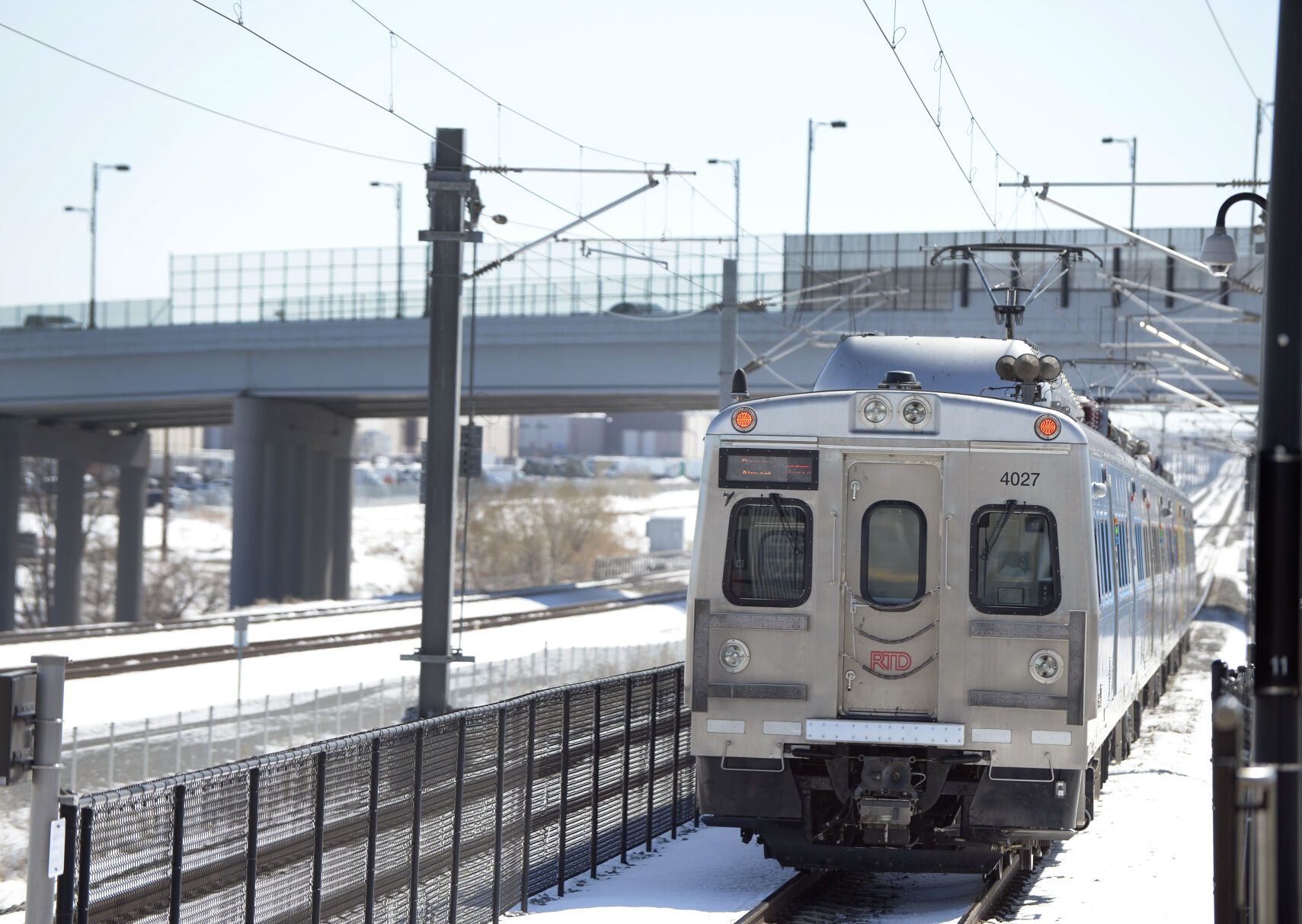 The RTD University of Colorado A Line train pulls away from Central Park Station on April 17, 2020, in Denver.