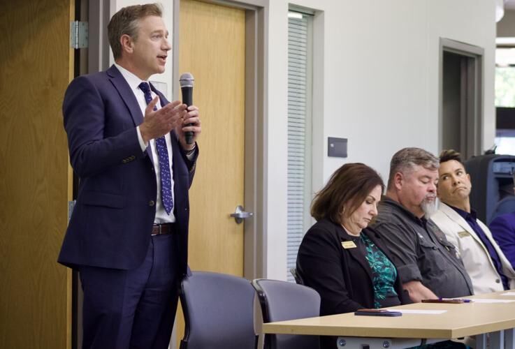 (Left to right) 18th Judicial District Judge Ryan Stuart speaks next to Douglas County District 3 Commissioner Lora Thomas, District 2 Commissioner George Teal and District 1 Commissioner Abe Laydon during a public meeting with Lone Tree residents on Thursday, May 30 in Lone Tree, Colo. Commissioners eventually withdrew Douglas County's proposal to build the 23rd Judicial District office near the RTD Lincoln Station. The office will include pre-trial and probation services but faced opposition from area residents. Noah Festenstein/Denver Gazette.