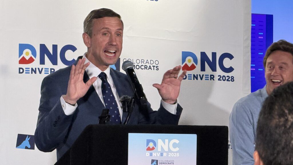 a man standing at a podium