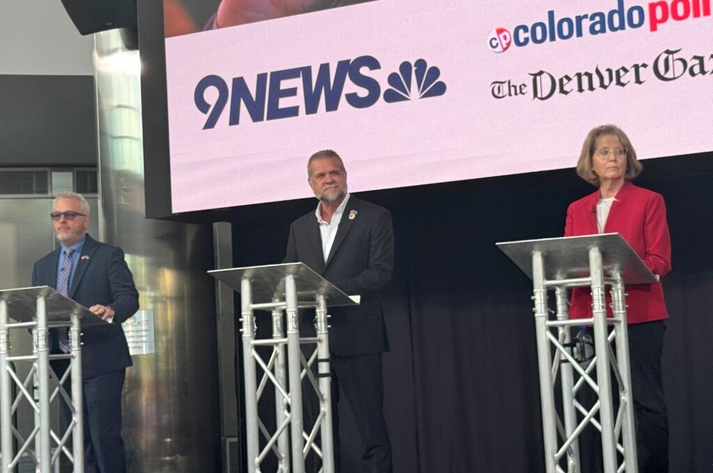 Colorado Republican gubernatorial candidates, from left, state Rep. Scott Bottoms, Victor Marx and state Sen. Barb Kirkmeyer take the stage at a primary debate sponsored by 9News and Colorado Politics on Tuesday, June 2, 2026, at the Cable Center on the University of Denver campus in Denver. (Thelma Grimes/Colorado Politics)