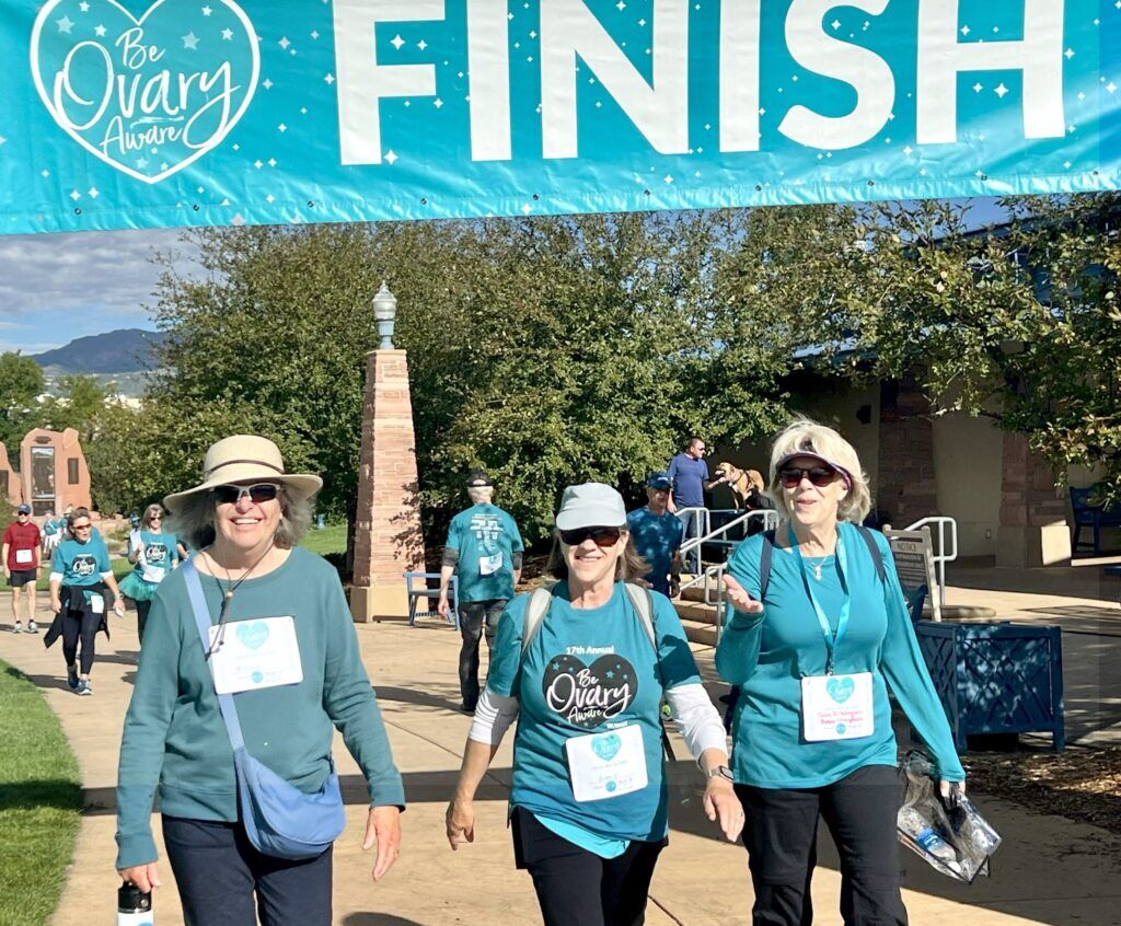 Tri-Lakes Women's Club members Robbie Larson, left, Sue Normile, center, and Jan McKinley cross the finish line at the 17th annual Be Ovary Aware Walk/Run on Sept. 21 at America the Beautiful Park in Colorado Springs. (Courtesy Tri-Lakes Women's Club)