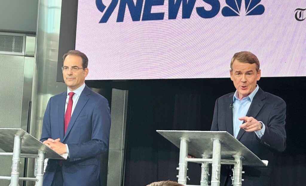 Democratic Colorado gubernatorial candidates, from left, Attorney General Phil Weiser and U.S. Sen. Michael Bennet participate in a debate sponsored by 9News and Colorado Politics on Thursday, June 4, 2026, at the University of Denver in Denver. (Thelma Grimes/Colorado Politics)
